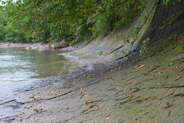 Smooth rocky slope on the river Bank.