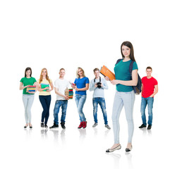 Obraz premium Large group of teenage students isolated on white background. Many different people standing together. School, education, college, university concept.
