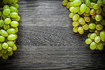 Ripe grapes on wooden board food concept