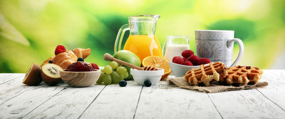 Breakfast served with coffee, orange juice, croissants and fruits. Balanced diet. - obrazy, fototapety, plakaty