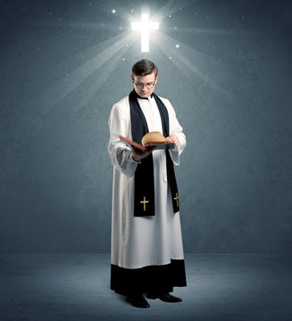 young priest in giving his blessing