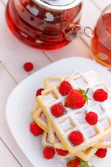 Belgian waffles with strawberries and raspberries. Top view.