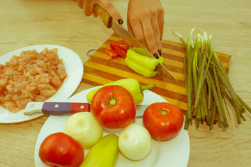 hands cooking in kitchen at home healthy food on a sunny day