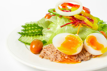 Salad with fresh vegetables, boiled egg and tuna.