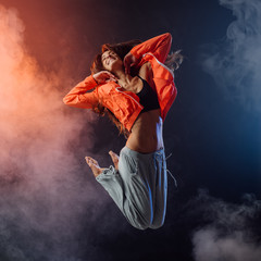 Performer dancing on dark background
