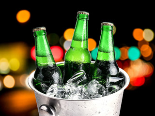 Beer bottles in ice bucket,