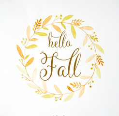 Fototapeta na wymiar Hello fall over hand drawing autumn flowers wreath in watercolor style on white paper background, greeting card, banner
