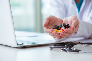 Medical concept with medicines and laptop computer