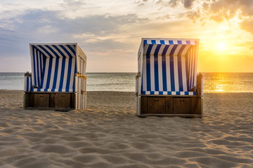 Sunset and beach chairs - Kampen, Sylt  - obrazy, fototapety, plakaty
