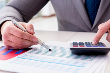 Finance analyst looking and financial reports