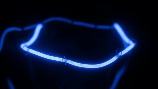 Smooth increase and decrease in power of the blue incandescent lamp.