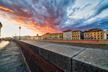 Fototapeta na wymiar scenic sunset on river in Pisa
