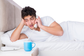 Man in bed suffering from insomnia