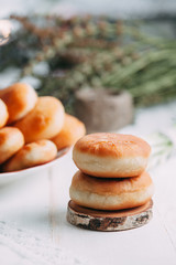 homemade pies with fish and mushrooms on a plate and wooden table