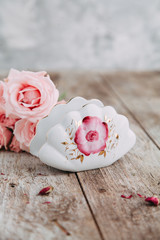 Souvenirs made of porcelain shot in the Studio with marshmallows and flowers. DIY and gift sets