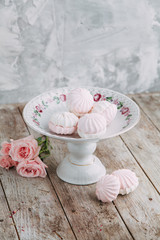 Souvenirs made of porcelain shot in the Studio with marshmallows and flowers. DIY and gift sets