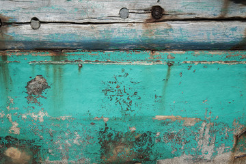 Old wooden boat wall background, Close up of wall with layers of chipping paint flakes