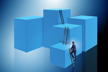 Businessman climbing blocks in challenge business concept
