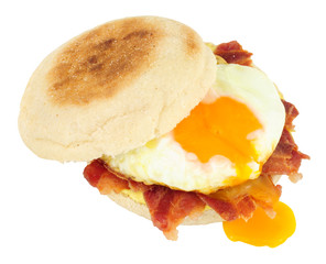 Egg and bacon muffin sandwich isolated on a white background