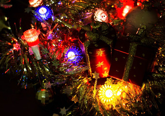 Christmas lights on a dark background. Place for the inscription.