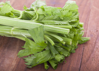 Fresh celery stalks on a white background