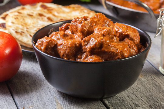 Chicken tikka masala served with bread naan