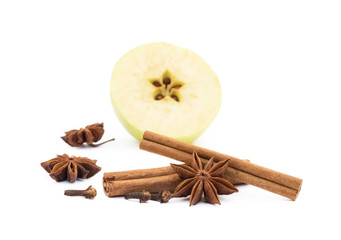 Aromatic apple, star anise, cloves and cinnamon isolated on white background