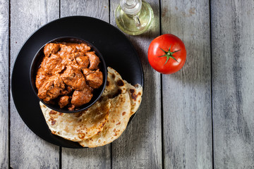Chicken tikka masala served with bread naan