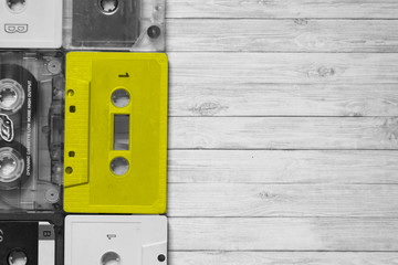 Old cassette tapes with a wooden background