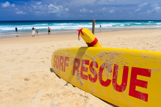 Yellow surf rescue board by the sea beach.