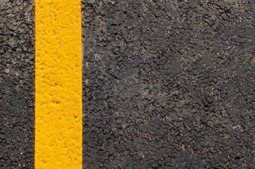 Yellow line on the road texture background