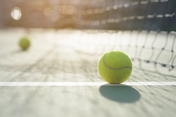 Tennis ball on blur net background