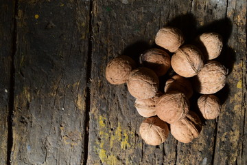 walnuts on a dark wooden table