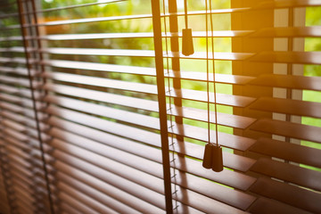 Wooden blinds with sun light. - obrazy, fototapety, plakaty