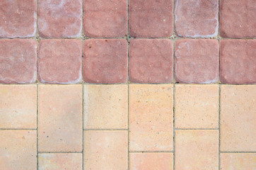 Naklejka premium Joint of Two Paving Textures from Concrete Rectangular Blocks. Two Color Tile Walkway