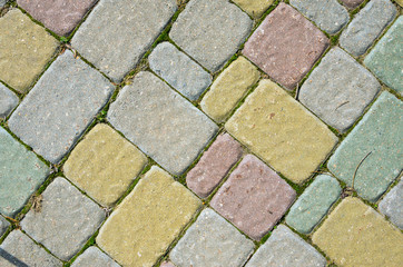 Multicolored Sidewalk Tile Texture. The Texture of Artificial Stone Pavers of Different Colors
