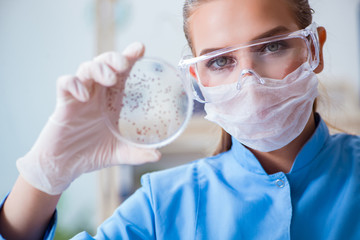 Female scientist researcher conducting an experiment in a labora