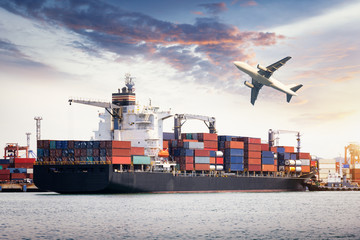 Container Cargo freight ship with working crane bridge in shipyard at dusk for Logistic Import Export background sunrise,sun light. © Aunging