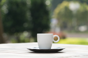 Fototapeta na wymiar Coffee cup on wooden tables 
