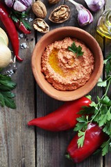 Paprika dip. Traditional middle eastern dip from roasted paprika, nuts, onion and garlic with fresh parsley. Copy space