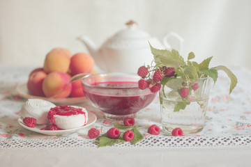 Raspberry jam, peaches. marshmallows and raspberries still life with sweets