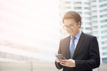 Fototapeta premium close up of Young Man using phone. or Business man Contact Customer