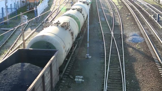 Freight train passing by at sunset