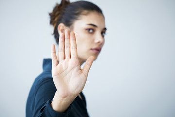 Woman making stop gesture with her hand