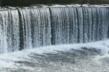 Water cascade streaming down a lasher