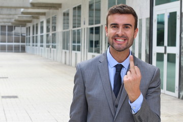 Insulting businessman throwing the middle finger 