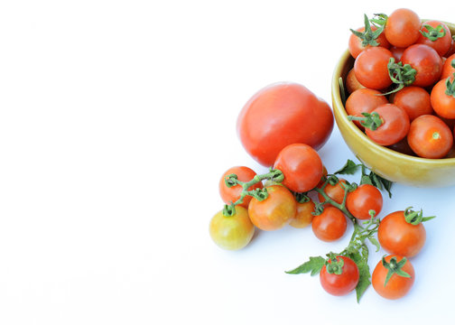 close up of fresh tomatos vegetable in bowl on white backgrounds