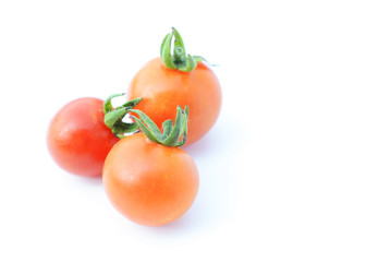 Three cherry tomatos vegetable isolated on white backgrounds