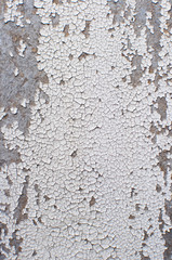 Obraz premium Old gray background texture of wall with cracked paint. Worn colored texture. Abstract banner with copy space.