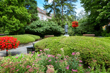 Beautiful lawn with flowers in front of the house